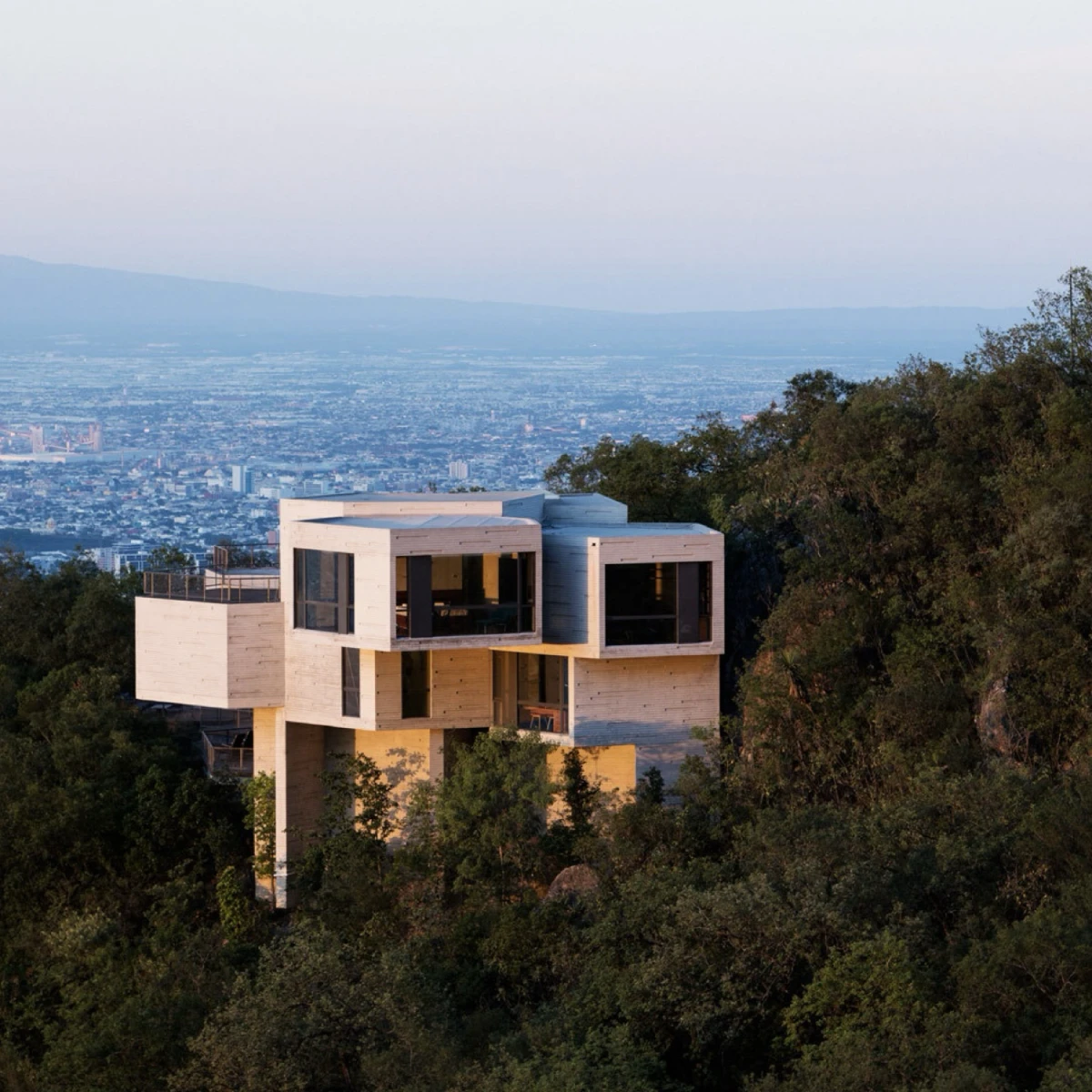 Aerial shot of the Haus Ventura designed by Tatiana Bilbao on the side of a hill in San Pedro Garza Garcia, Nuevo Leon, Mexiko. Built between 2008-2011.
