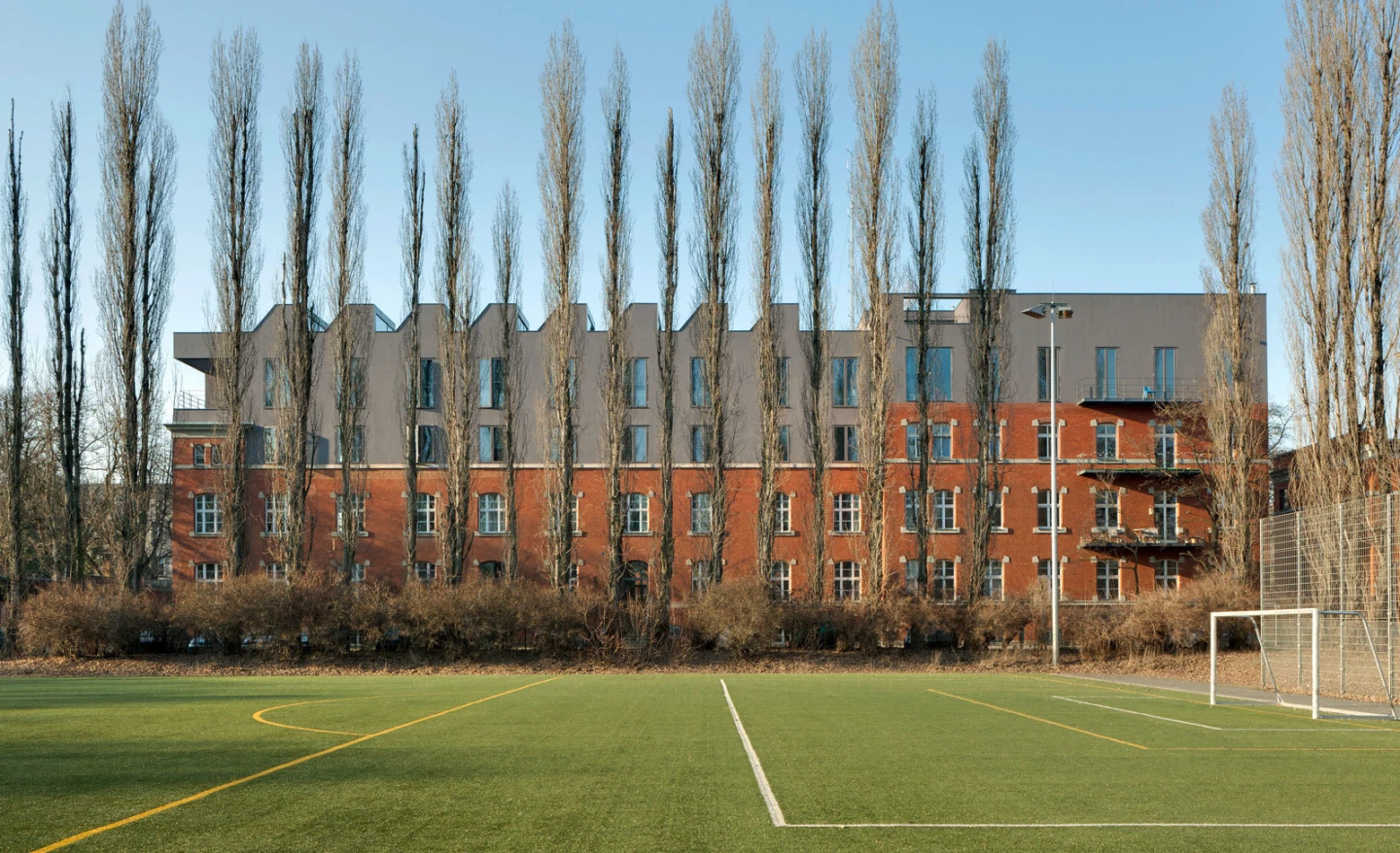 Photo of the outside of the Sauerbruch Hutton practice located in the Berlin borough of Moabit. The architects added two further storeys to the period brick building.