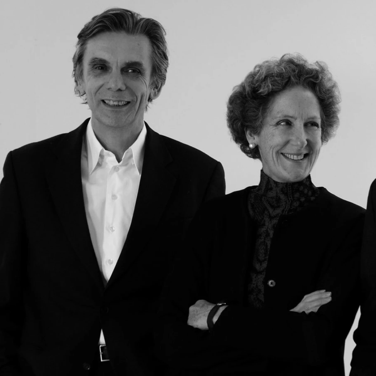 Black-and-white portrait of the Sauerbruch Hutton practice members in Berlin. From left to right the two founders Matthias Sauerbruch and Louisa Hutton.